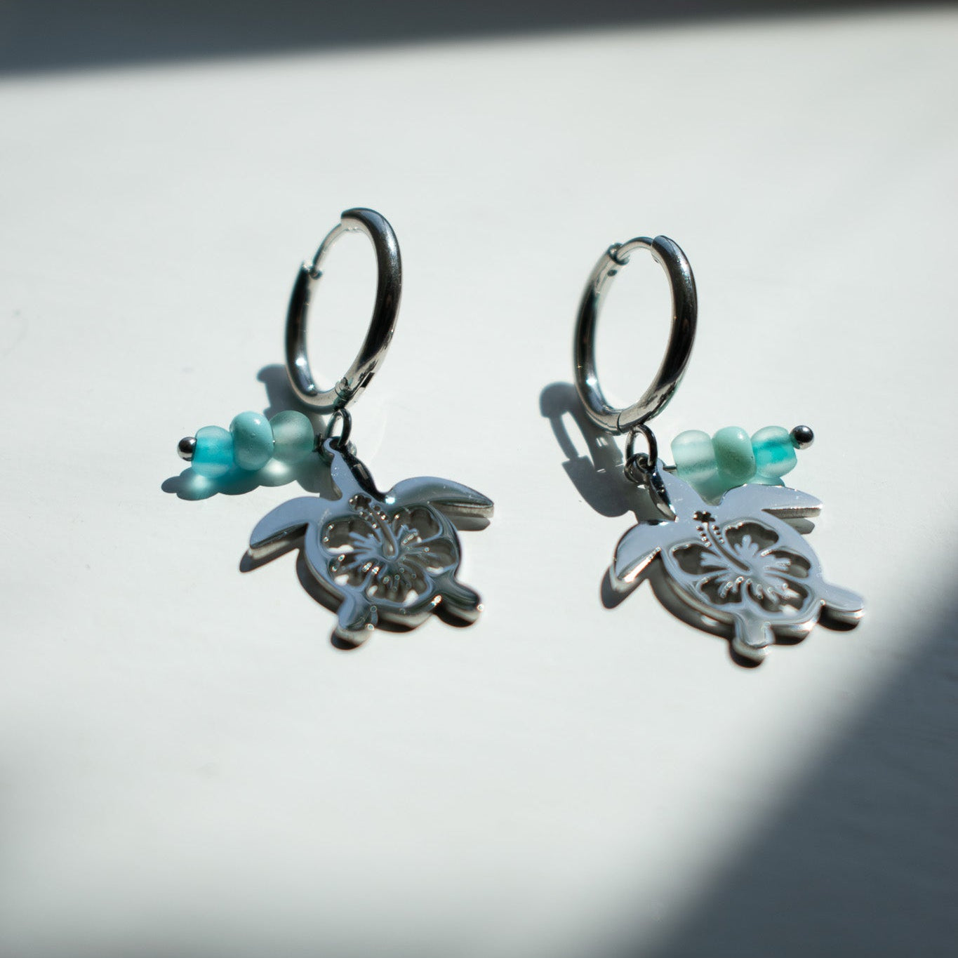 Silver Hibiscus Turtle Charm Earrings